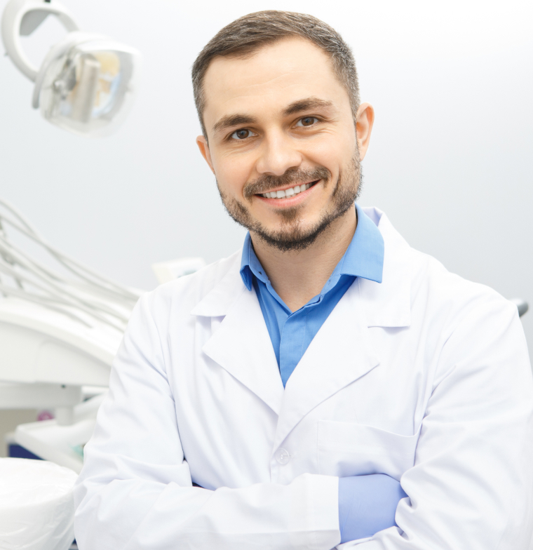 dentist crossing arms smiling